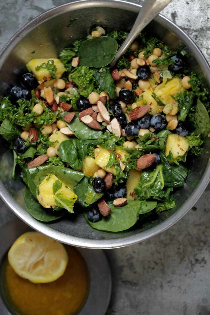 Raw Superfood Salad With Pineapple, Almonds + Turmeric Dressing